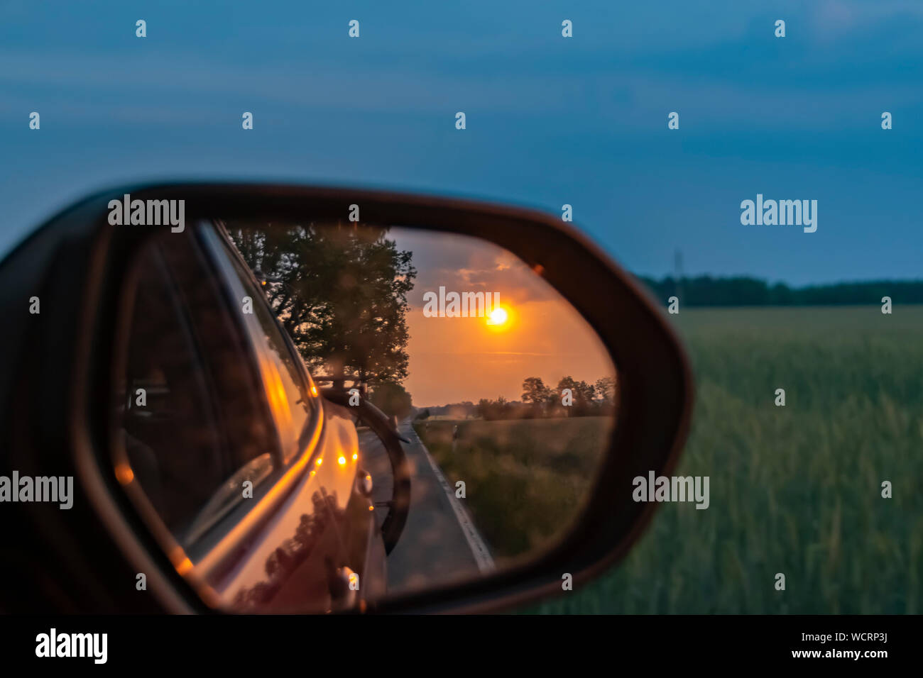 outside mirror of a moving car 