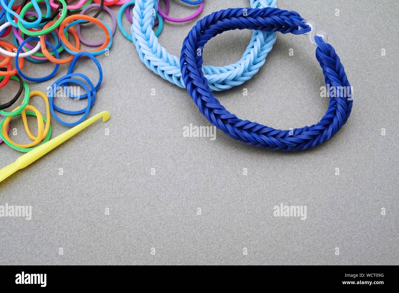 High Angle View Of Bracelets Made From Rubber Bands On Table Stock Photo