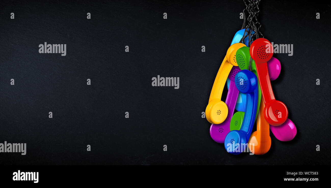bunch of colorful rainbow colored old fashioned retro phone reciever with black telephone wire on black slate copy space blackboard background, busine Stock Photo