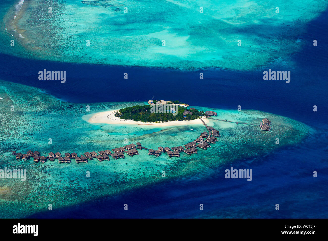 aerial view of tropical paradise maldives island resort with coral reef ...
