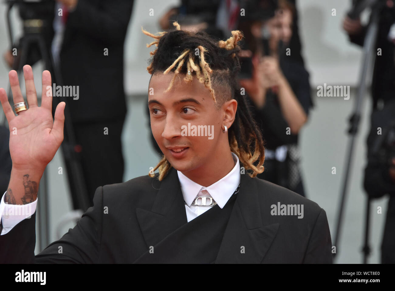 VENICE, Italy. 28th Aug, 2019. Ghali walks the red carpet ahead of the opening ceremony during the 76th Venice Film Festival at Sala Casino on August 28, 2019 in Venice, Italy. Credit: Andrea Merola/Awakening/Alamy Live News Stock Photo