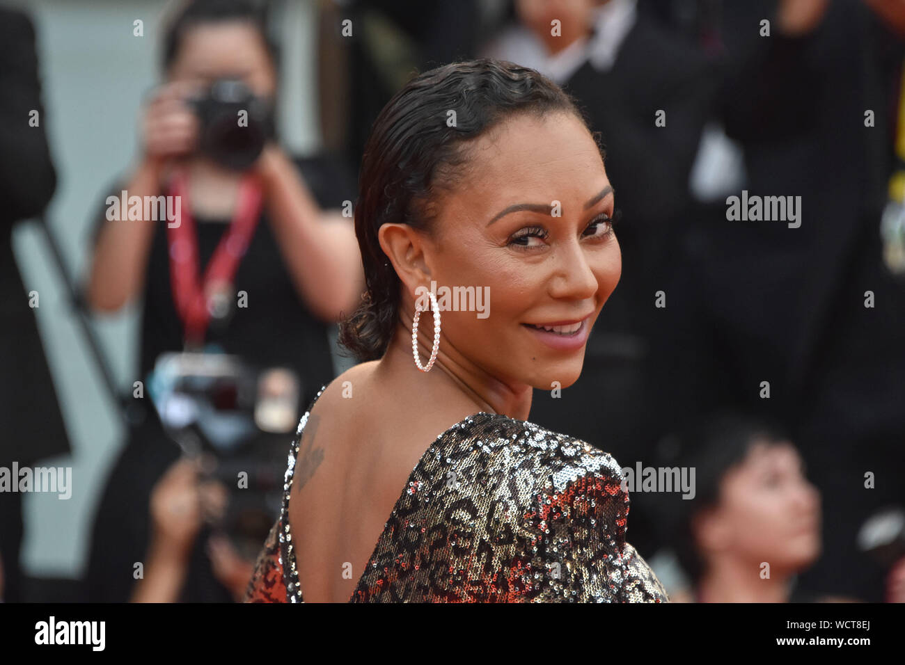 VENICE, Italy. 28th Aug, 2019. Melanie Brown walks the red carpet ahead of the opening ceremony during the 76th Venice Film Festival at Sala Casino on August 28, 2019 in Venice, Italy. Credit: Andrea Merola/Awakening/Alamy Live News Stock Photo