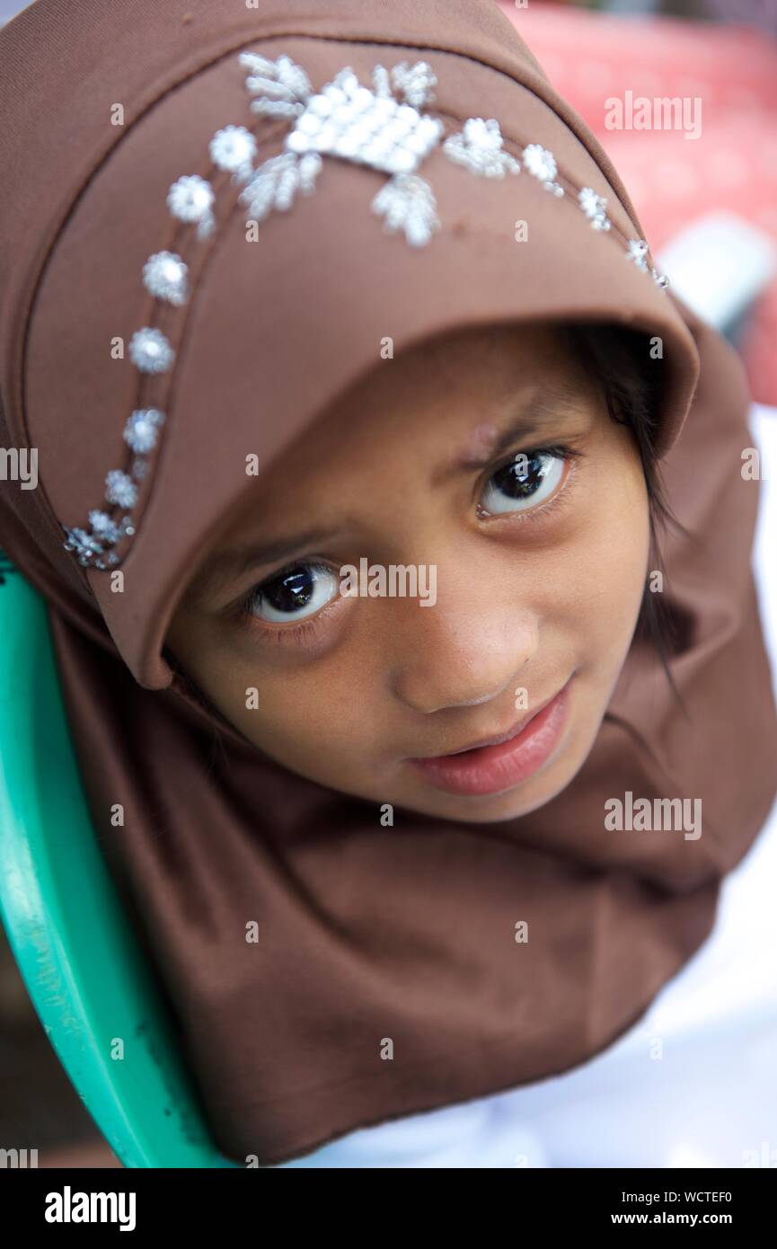 A young girl child attends the Oplan Balik Tahderiyyah before Tahderiyyah opens for the summer, at Madrasa Aziza Al-Islamia in Barangay Polonuling in Tupi municipality in the province of South Cotabato.  Balik Tahderiyyah is a way to foster Tahderiyyah partnership within its community. It highlights the value of volunteerism, bringing together the teachers, mudeers (administrators), parents and other stakeholders within a community to work together.  The Tahderiyyah program is an integrated early childhood education program designed to reach young children in hard to reach areas due to distanc Stock Photo