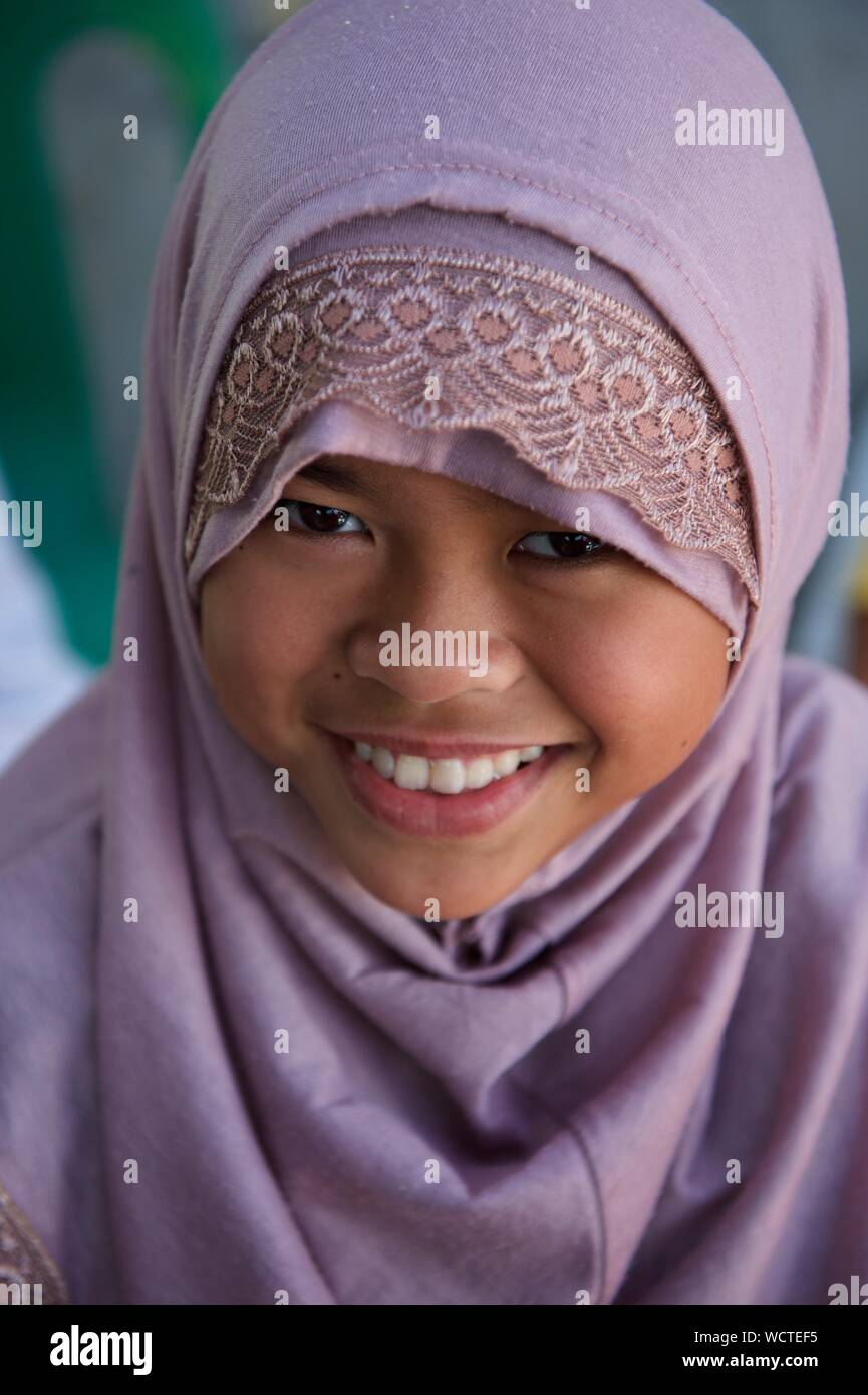 A young girl child attends the Oplan Balik Tahderiyyah before Tahderiyyah opens for the summer, at Madrasa Aziza Al-Islamia in Barangay Polonuling in Tupi municipality in the province of South Cotabato.  Balik Tahderiyyah is a way to foster Tahderiyyah partnership within its community. It highlights the value of volunteerism, bringing together the teachers, mudeers (administrators), parents and other stakeholders within a community to work together.  The Tahderiyyah program is an integrated early childhood education program designed to reach young children in hard to reach areas due to distanc Stock Photo