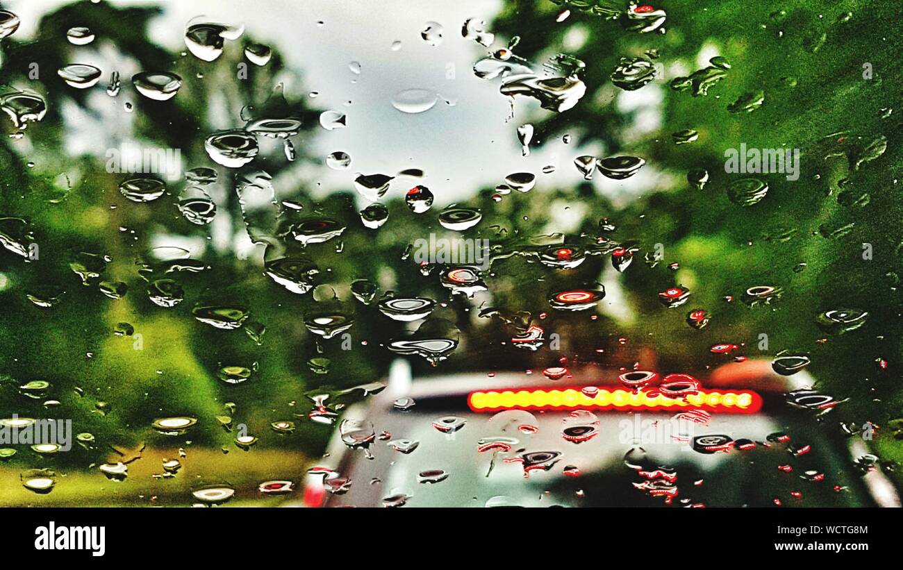 Car Seen Through Wet Windshield Stock Photo Alamy