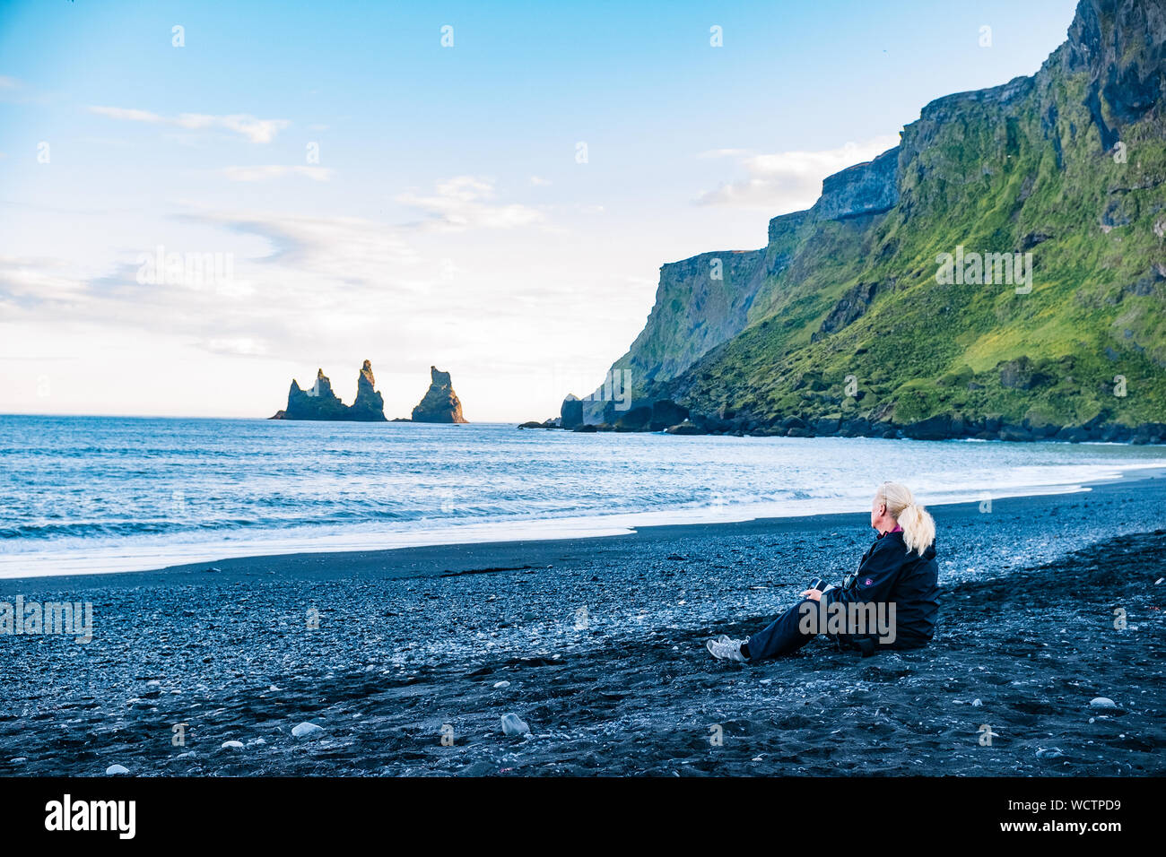 Mature woman sitting beach hi-res stock photography and images - Alamy