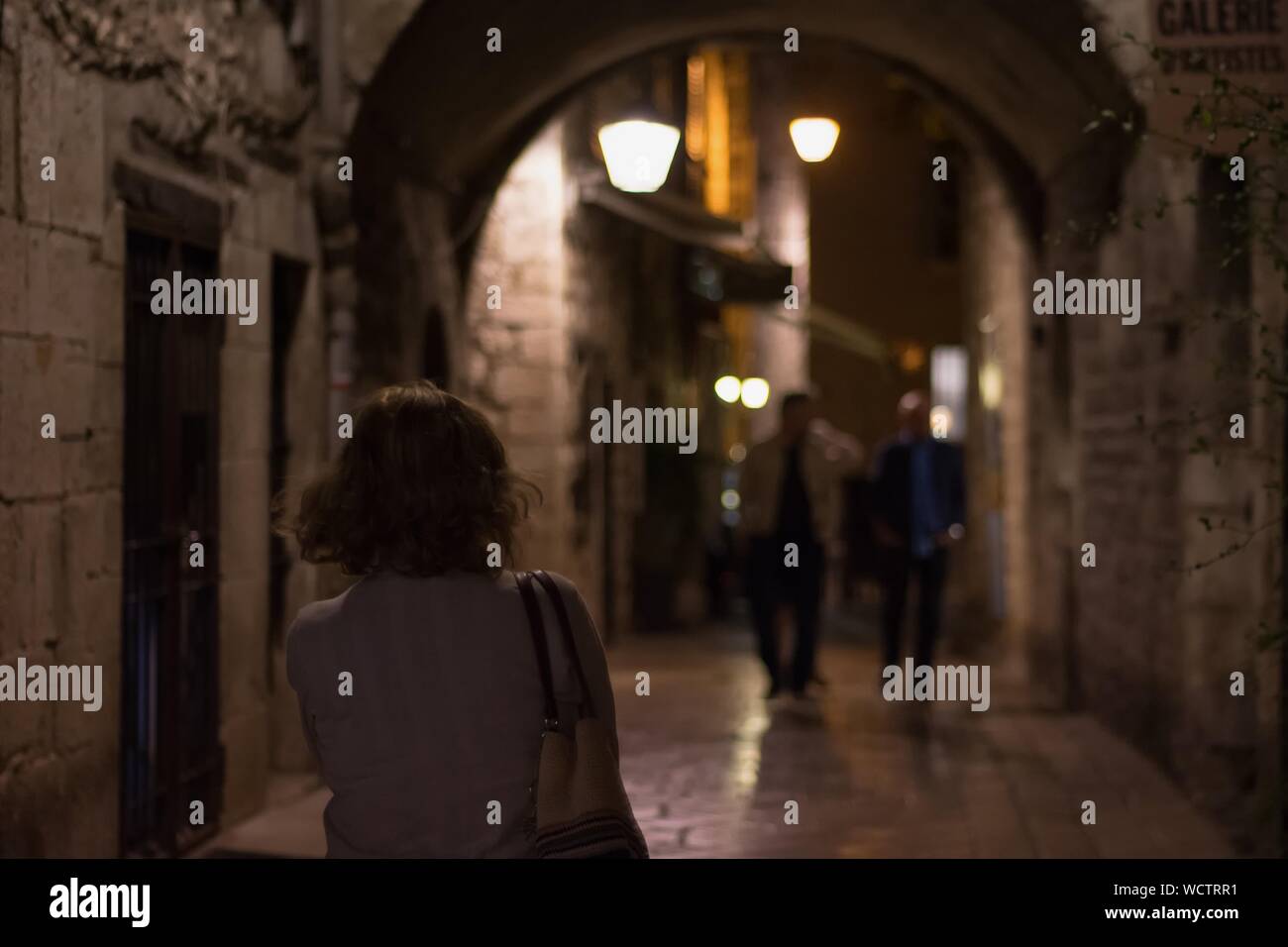 Woman walking alone night hi-res stock photography and images - Alamy