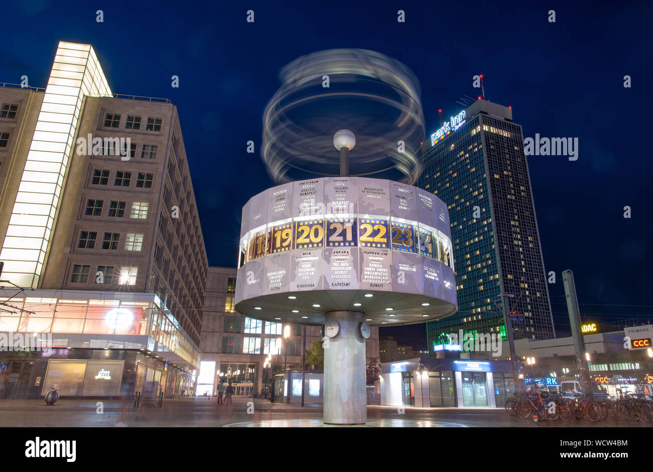 Berlin, Germany. 28th Aug, 2019. In the evening above the world time clock rotates a representation of the solar system with planets and their orbits represented with steel circles (photo with long exposure). Credit: Monika Skolimowska/dpa-Zentralbild/dpa/Alamy Live News Stock Photo