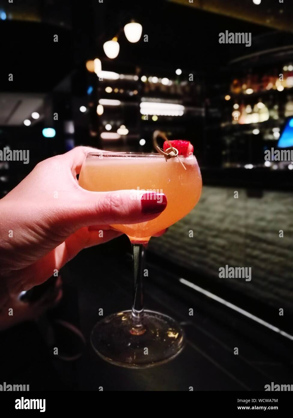 Woman holding cocktail bar hi-res stock photography and images - Alamy