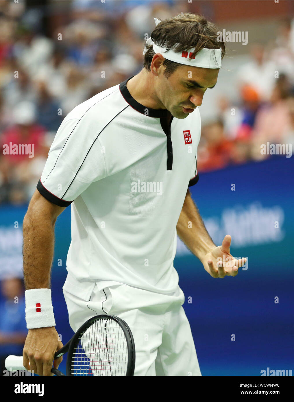 Roger Federer of Switzerland reacts after losing a point to Damir Dzumhur  of Bosnia and Herzegovina in the second round match at the 2019 US Open  Tennis Championships at the USTA Billie