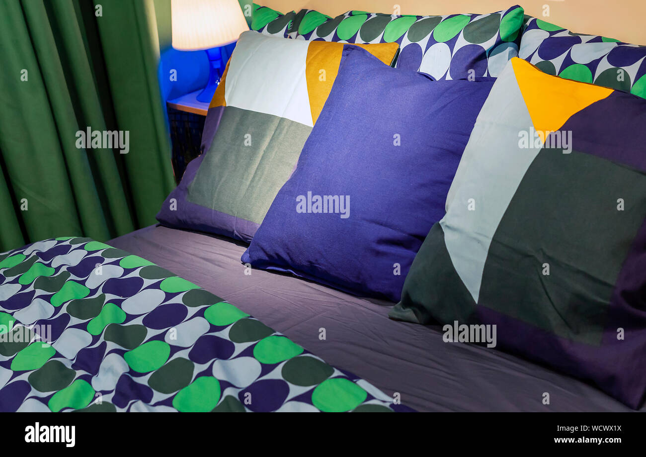Pillows With Bright Pillowcases In The Interior Of The Bedroom
