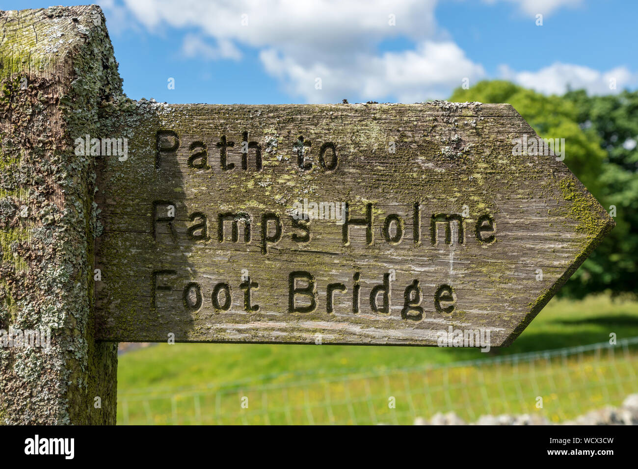 Footpath sign to Ramps Holme bridge over the RIver Swale in Swaledale, North Yorkshire Stock Photo
