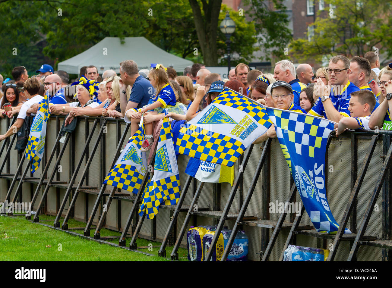 Warrington Wolves bring the Coral Challlenge Cup back home-fans wait against the fencing Stock Photo