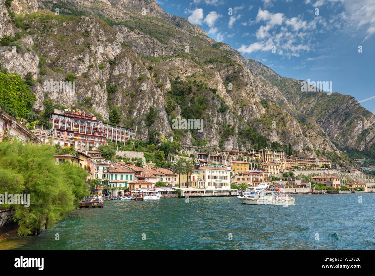 Limone on the shores of Lake Garda underneath a huge cliff wall. Stock Photo