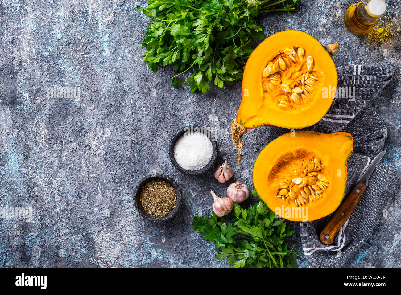 Halves of hokkaido pumpkin with spices Stock Photo - Alamy