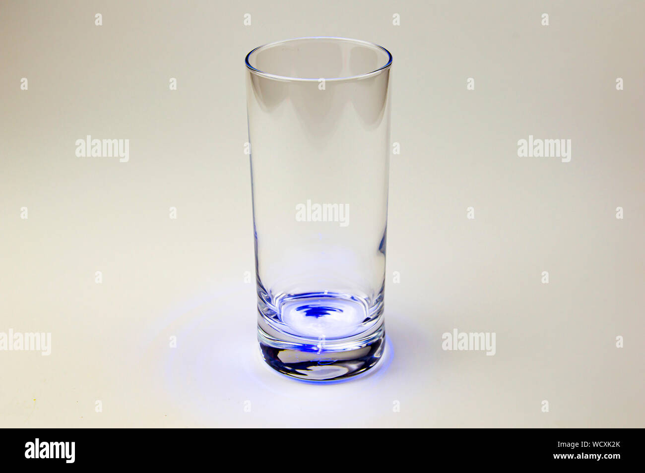 Empty glass transparent glass with color illumination. Background image ...