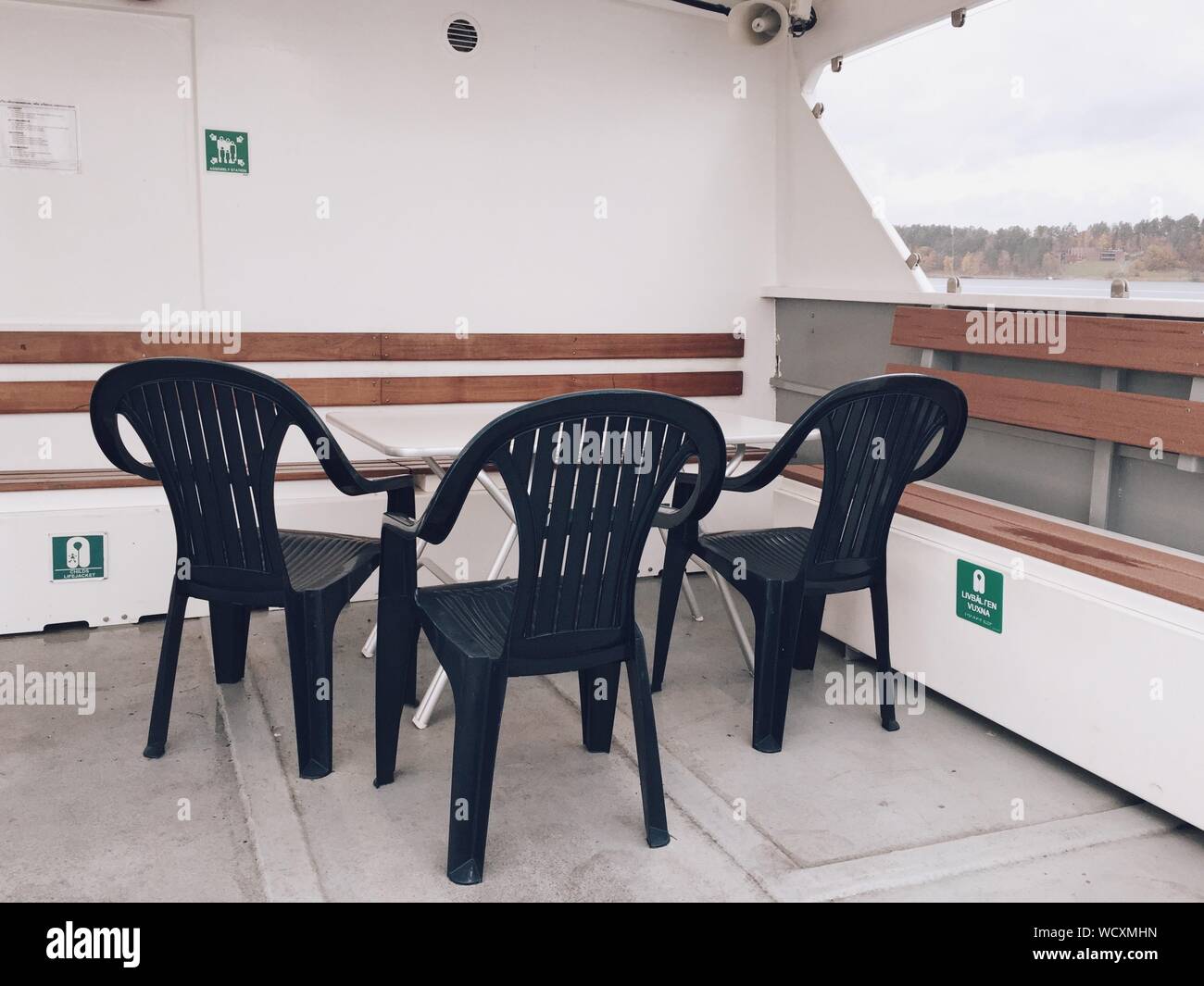 Empty Chairs And Table On Boat Deck Stock Photo Alamy