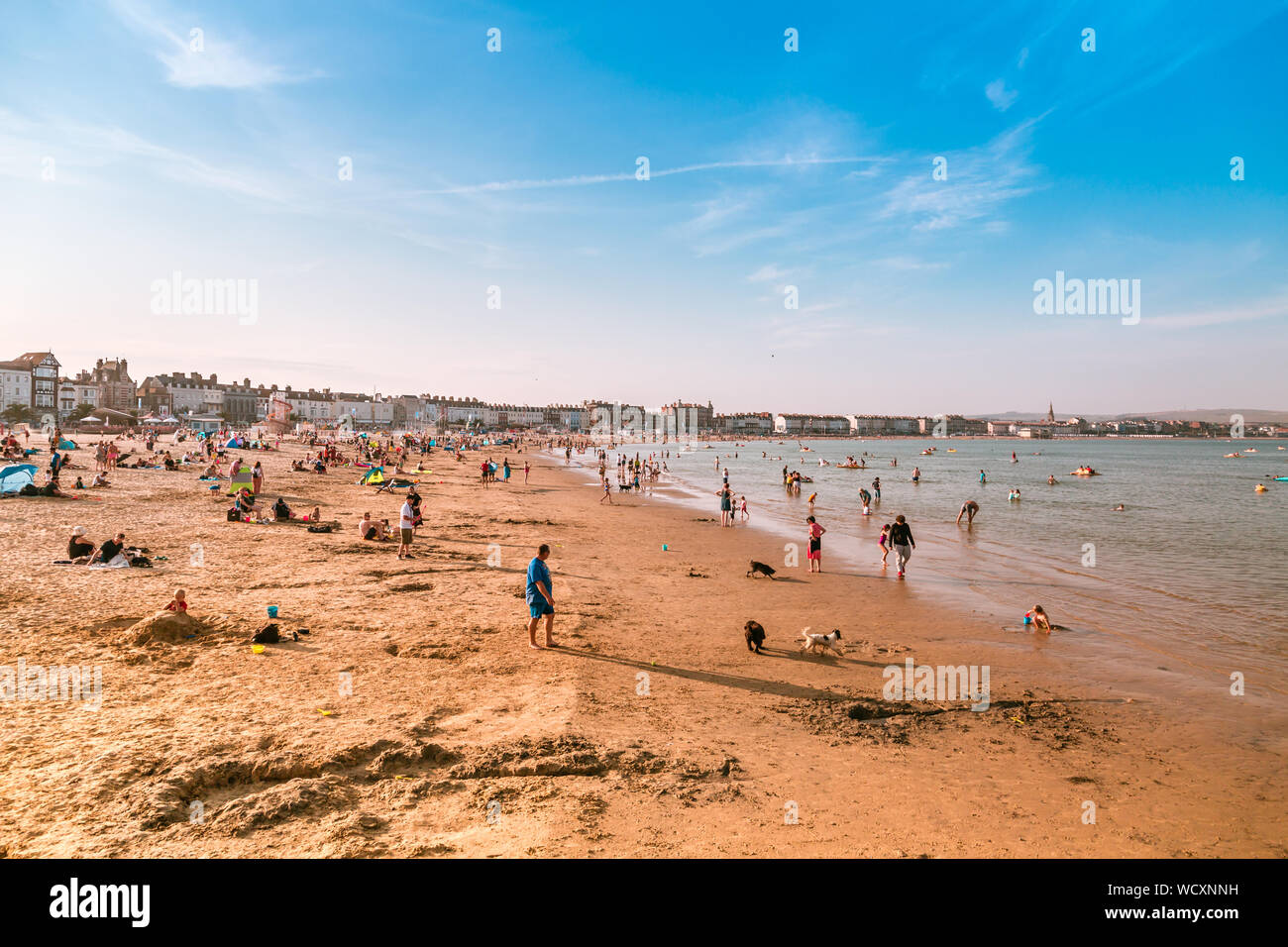 Holidaymakers on the Sand beach at Weymouth Beach for Summer, Dorset, England, UK Stock Photo