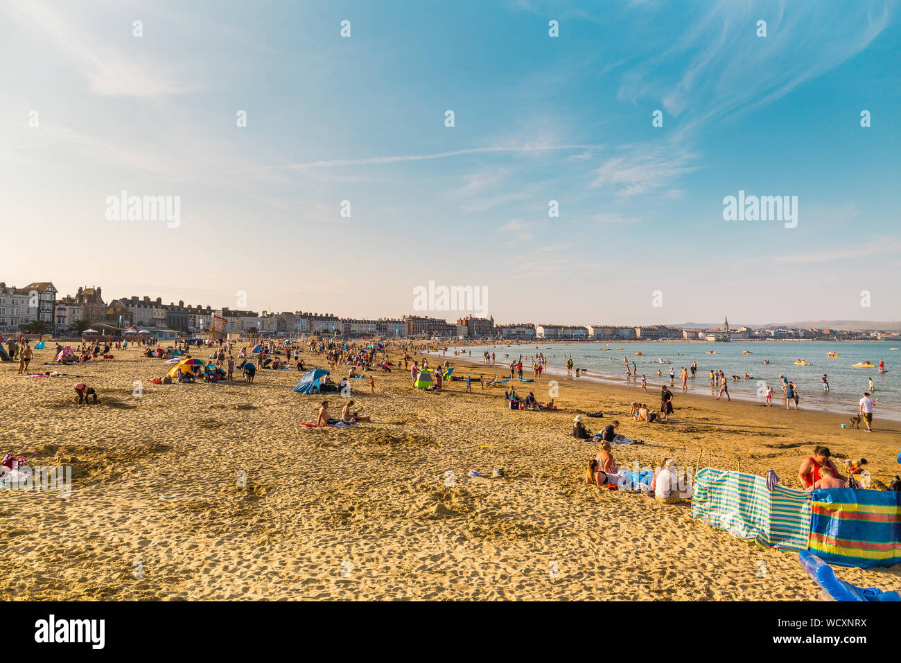 Holidaymakers on the Sand beach at Weymouth Beach for Summer, Dorset, England, UK Stock Photo