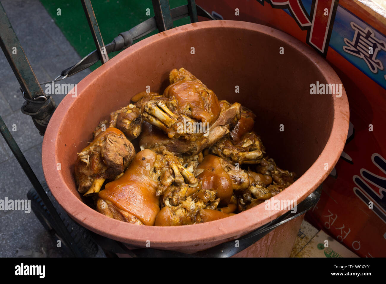 High Angle View Of Cooked Trotters In Container For Sale At Namdaemun Market Stock Photo