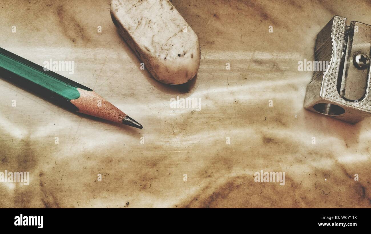 Close-up Of Pencil With Eraser By Sharpener On Table Stock Photo - Alamy