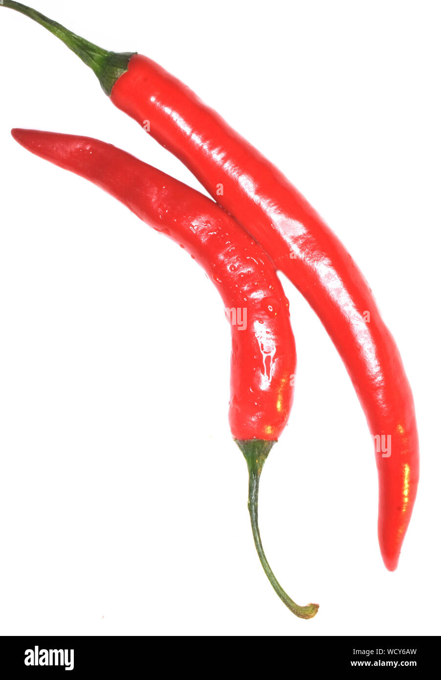 Close-up Of Chilies On White Background Stock Photo
