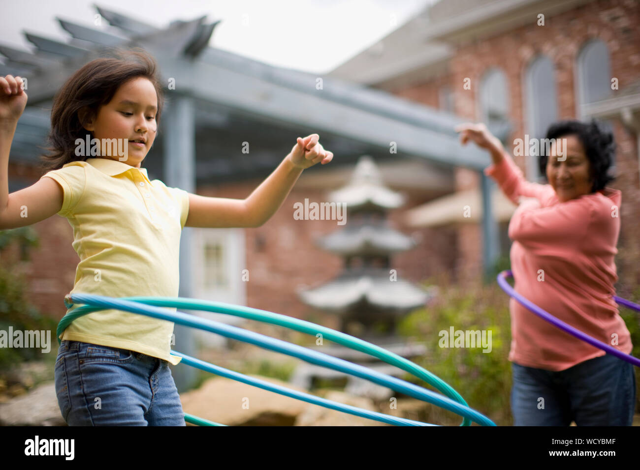 Sisters on their way to birthday party with balloons Stock Photo