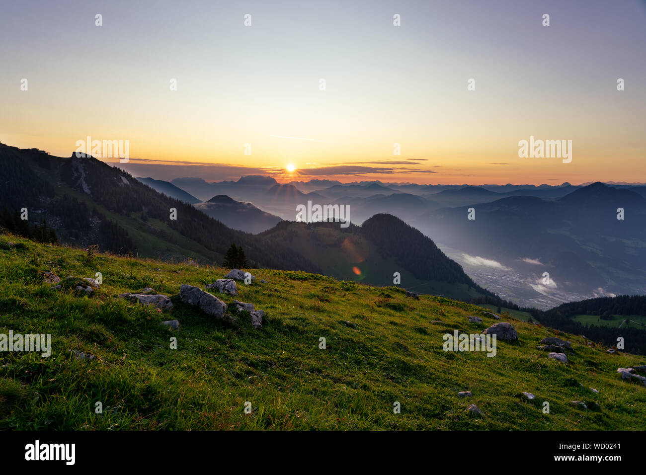 Sunrise over the tyrol alm high over the mountains scenery Stock Photo