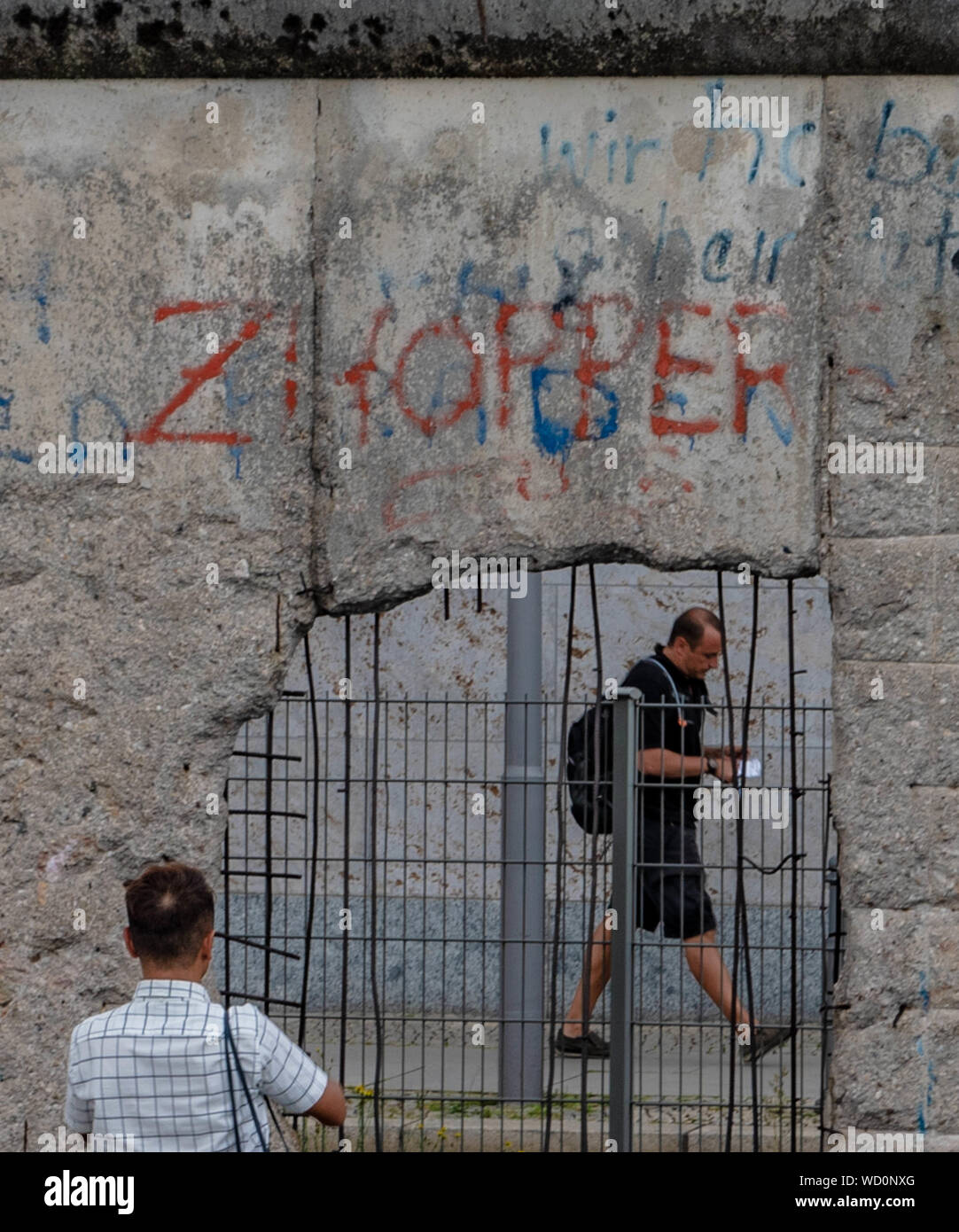 View from the former East Germany through a hole in the Berlin Wall Stock Photo