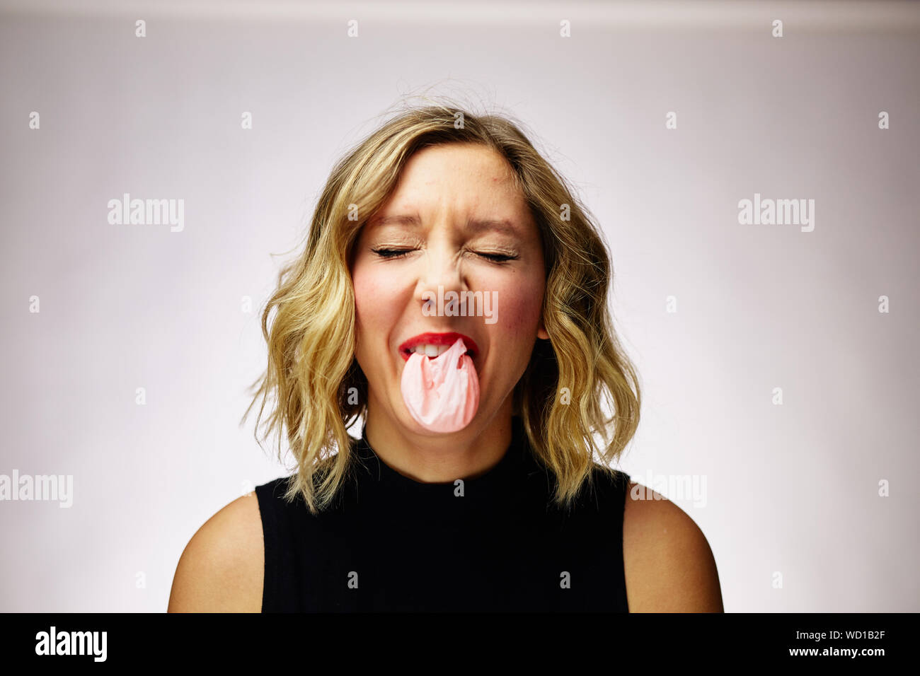 Caucasian woman blowing bubble gum hi-res stock photography and images ...