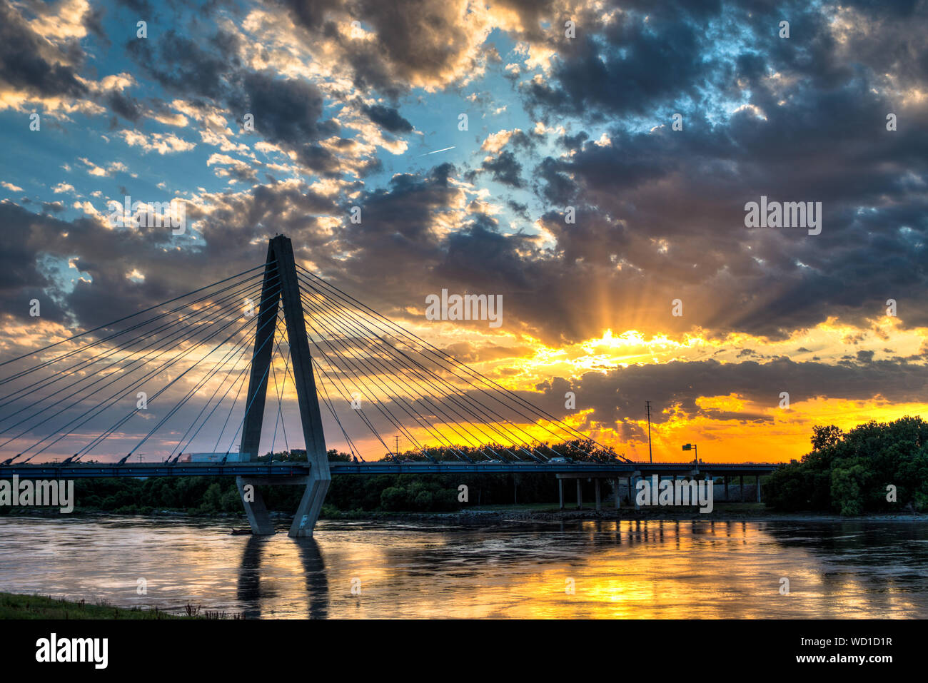 Christopher S Bond Bridge Over Missouri River Against Cloudy Sky At Sunset Stock Photo