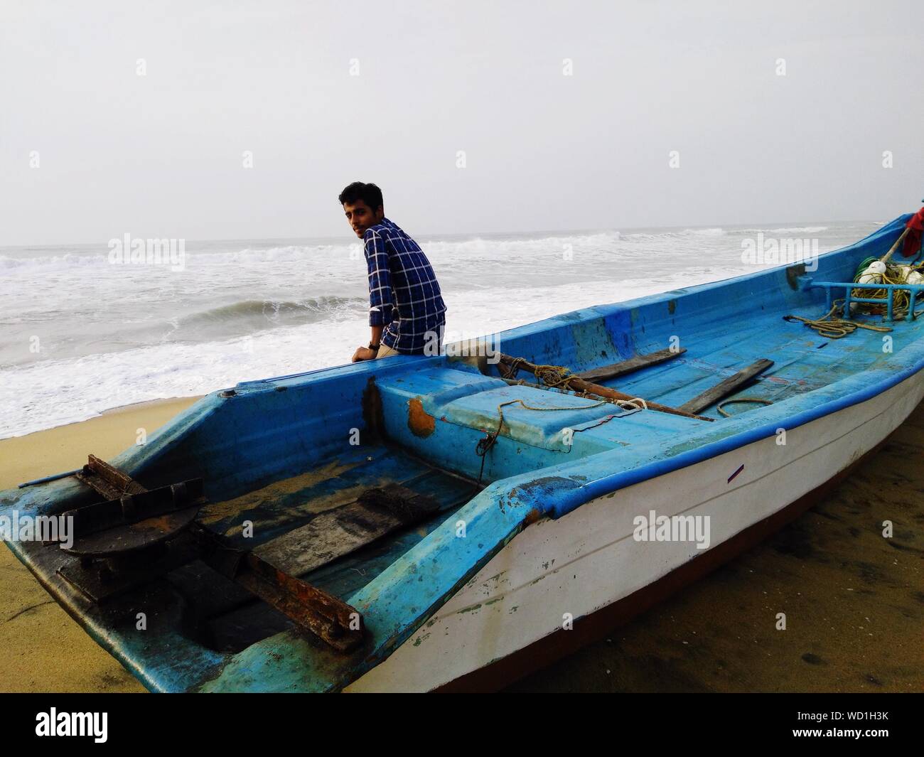 Indian man sitting on boat hi-res stock photography and images - Alamy