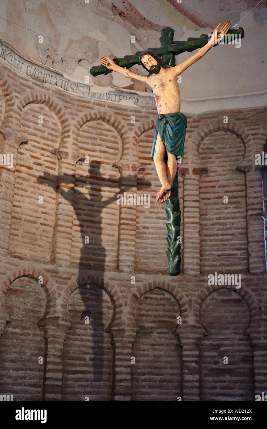 TOLEDO, SPAIN - APRIL 24, 2018: Sculpture of Jesus on the cross in the interior of the Mosque Cristo de la Luz. Stock Photo
