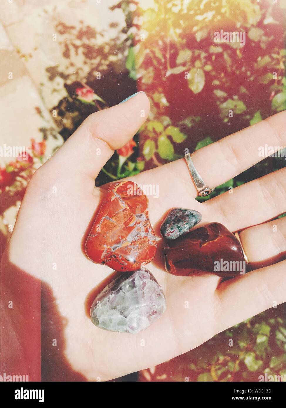 Gemstones hand hi-res stock photography and images - Alamy