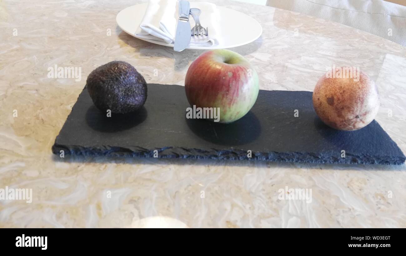 Fruits On Slate Over Table Stock Photo