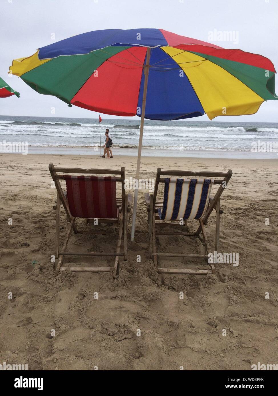 Deck Chairs And Parasol At Beach Stock Photo Alamy