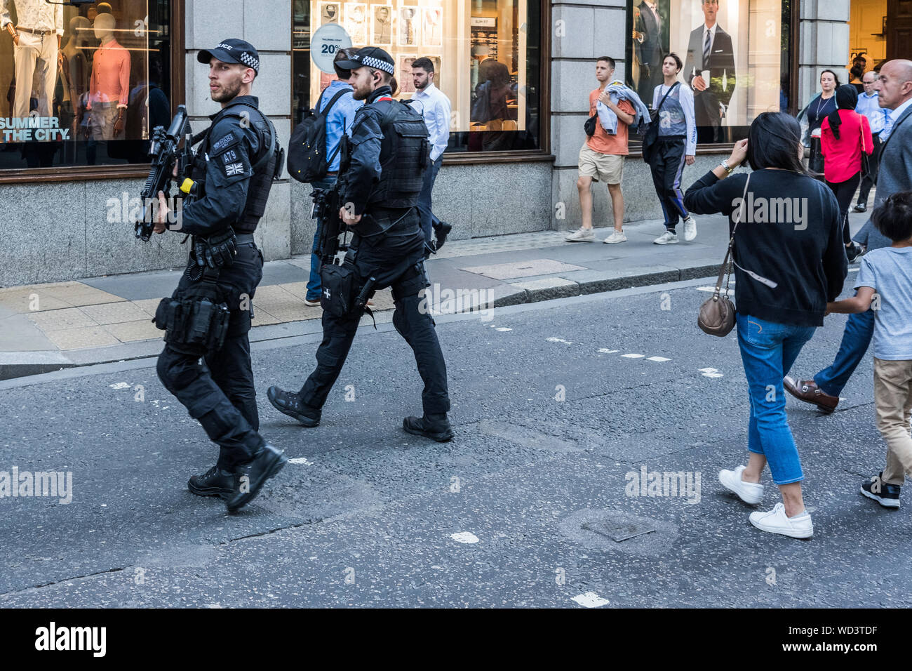 Armed City of London police officers patrol the capital's street's, City of London, England, U.K. Stock Photo