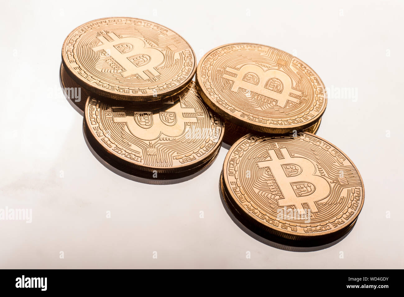 Close-up Of Bitcoins On Table Stock Photo