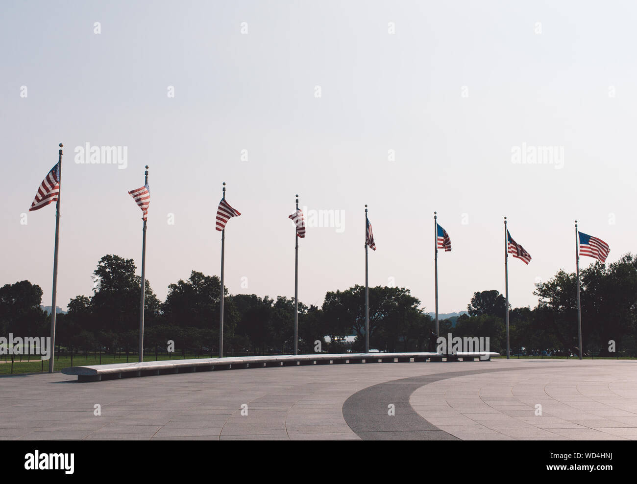 American Flags Fluttering Against Clear Sky Stock Photo