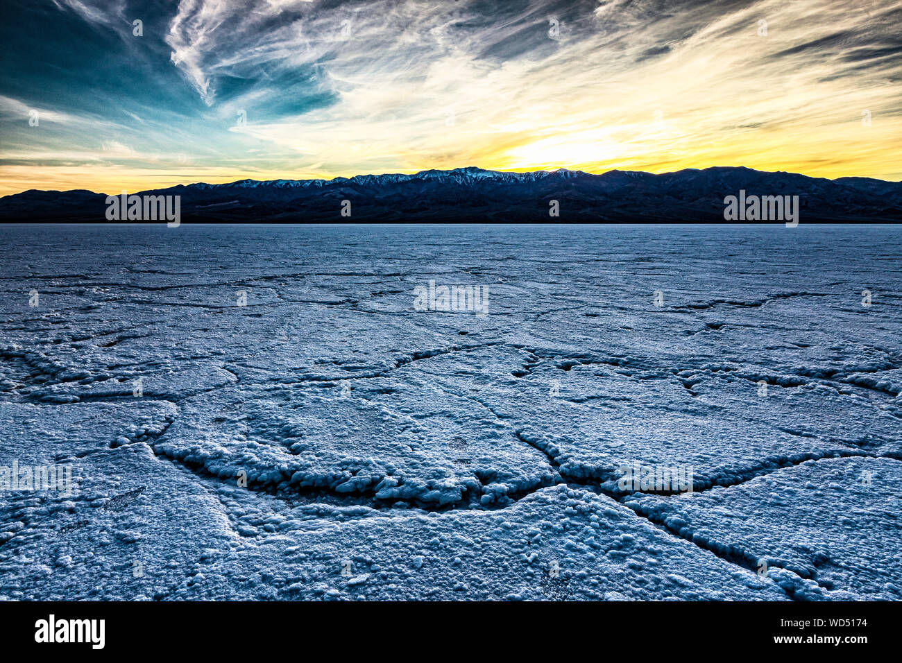 Sunset over the Panamint Mountains seen from Badwater salt flats in Death Valley, California. Stock Photo