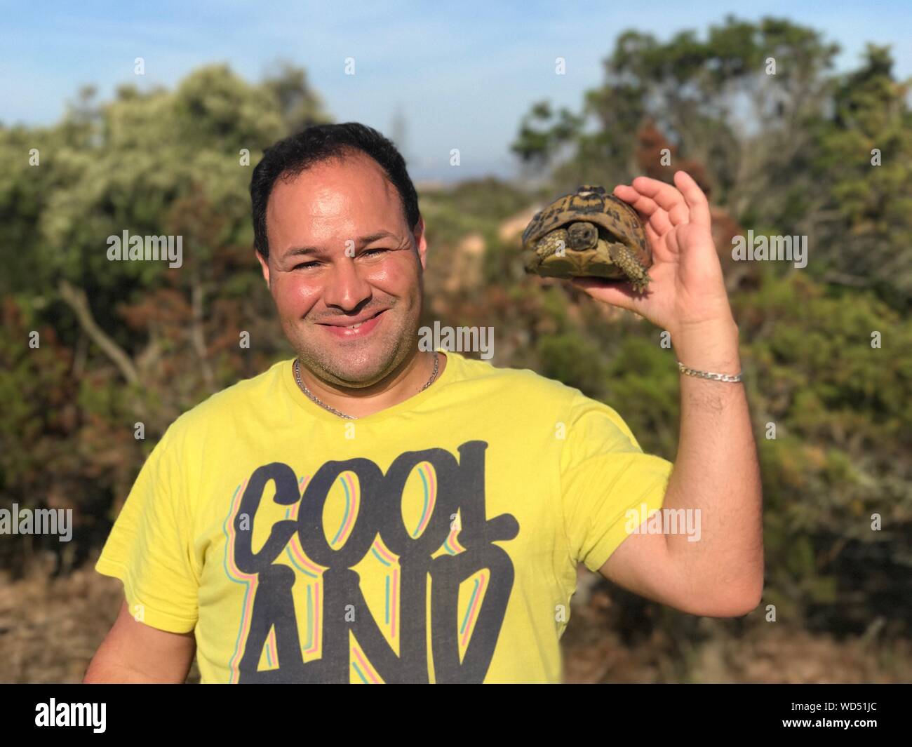 Person holding turtle hi-res stock photography and images - Alamy