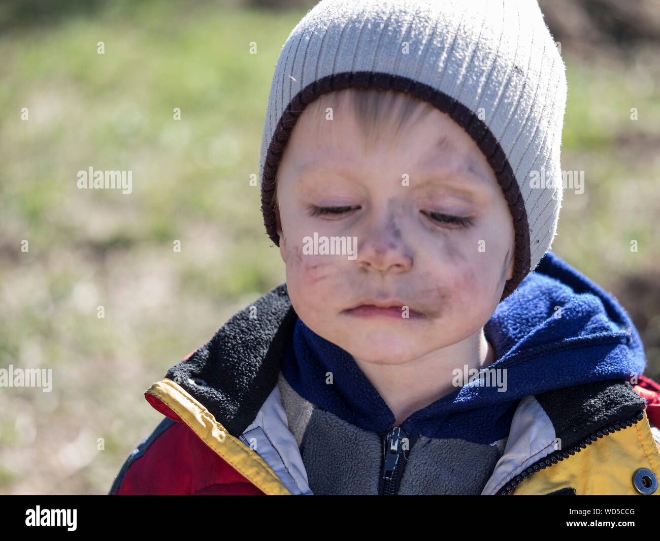 Close-up Of Boy With Soot Smear On Face Stock Photo