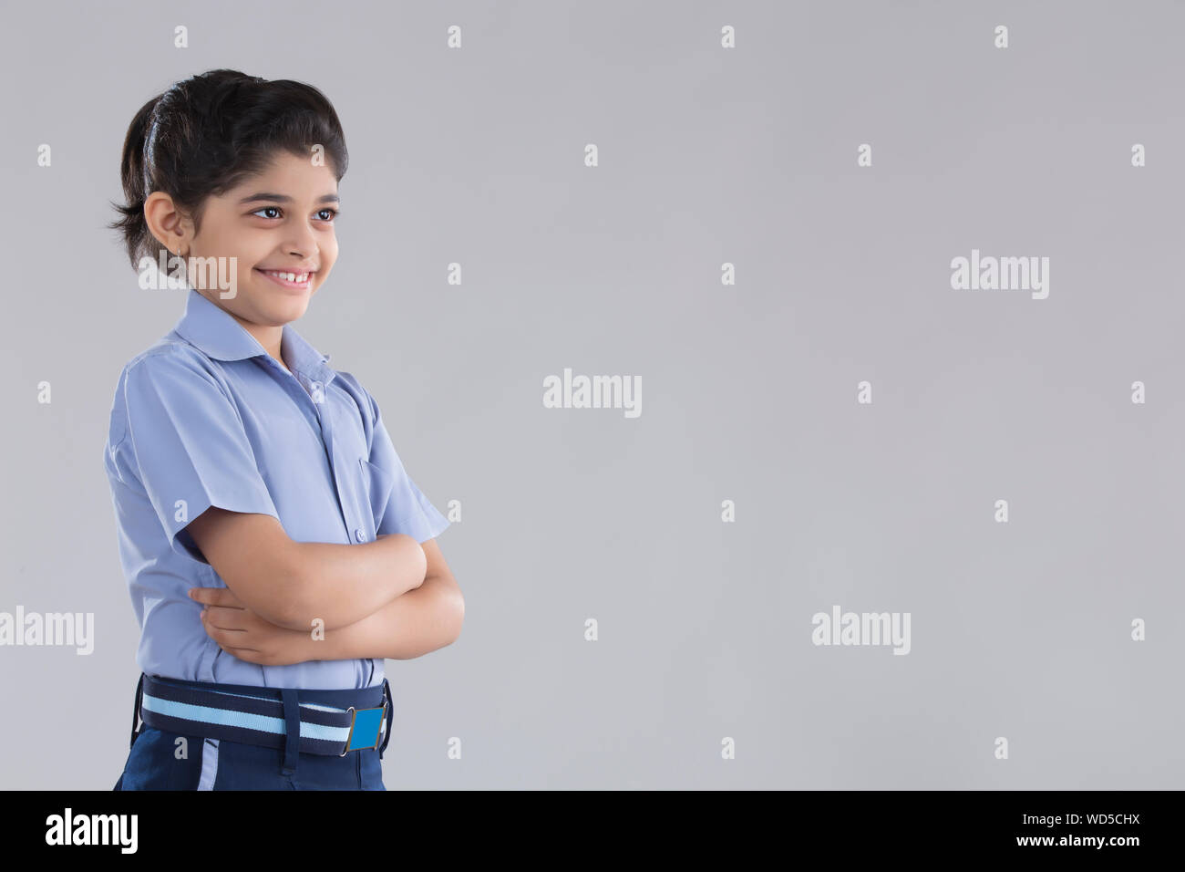 portrait of a school girl smiling at something Stock Photo - Alamy