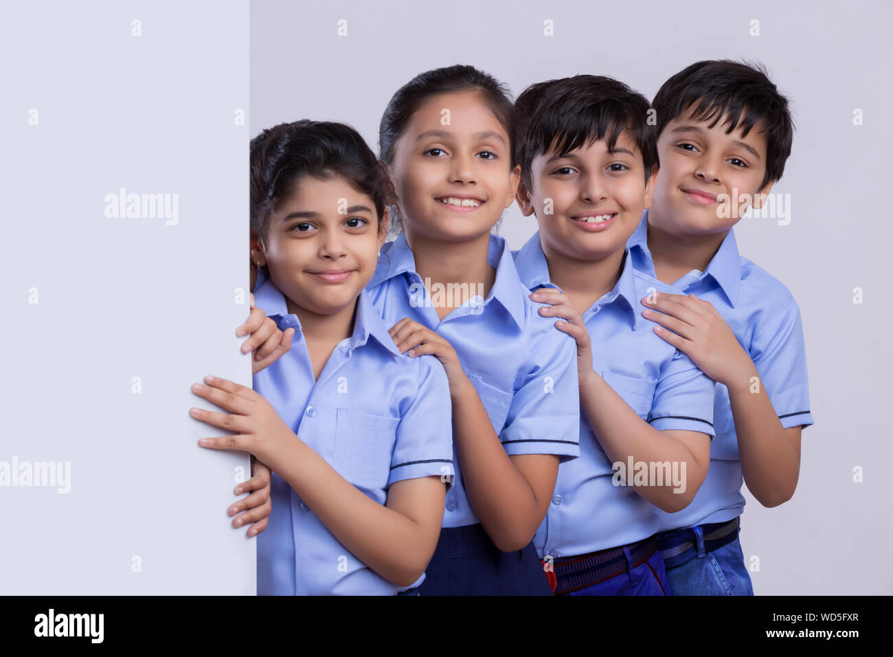 portrait of school children standing and smiling Stock Photo - Alamy