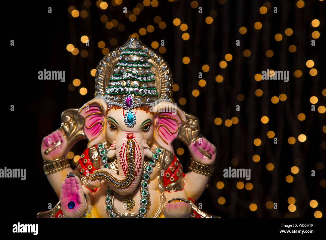 ganesh idol with lights in background Stock Photo