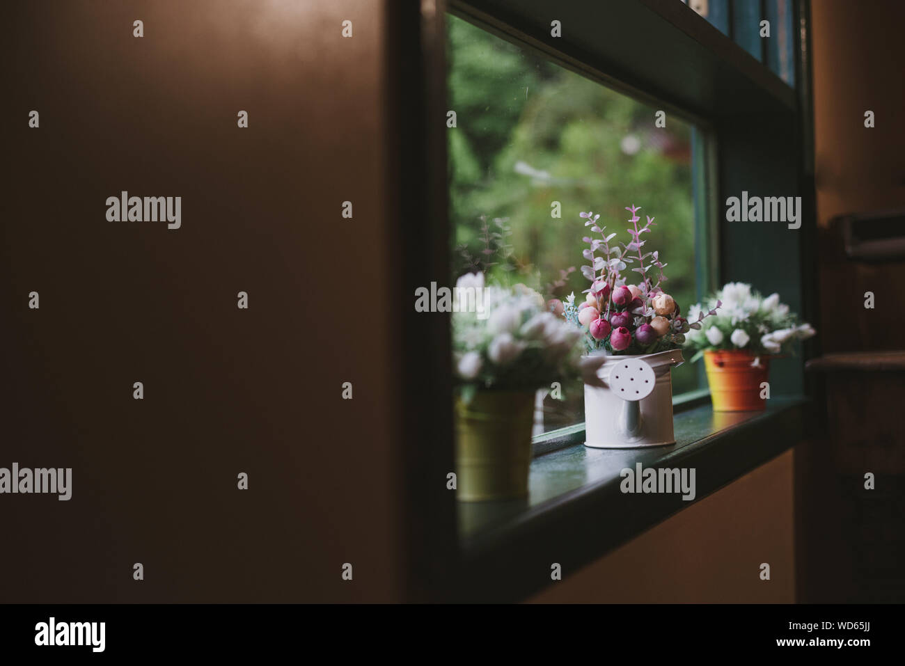 Artificial Flower Pots On Window Sill Stock Photo Alamy