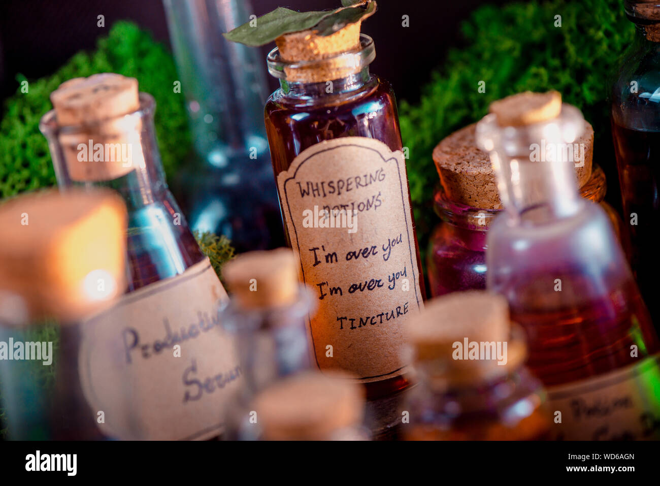 Potions, mixtures, and remedies for inspiration, motivation and productive work close-up. Handwritten potion label. Broken heart cure concept. Stock Photo