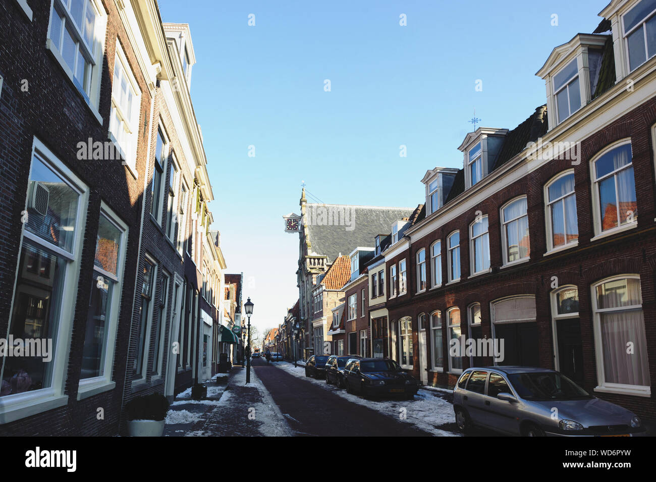 Hoorn, North Holland / Netherlands - March 11, 2012: Snow on streets of Hoorn city at sunny winter day. Stock Photo