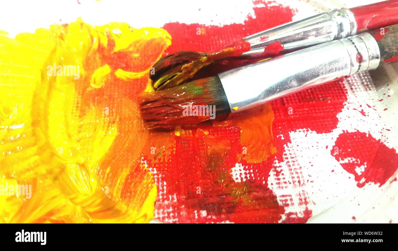 Close-up Of Paintbrushes On Canvas Stock Photo