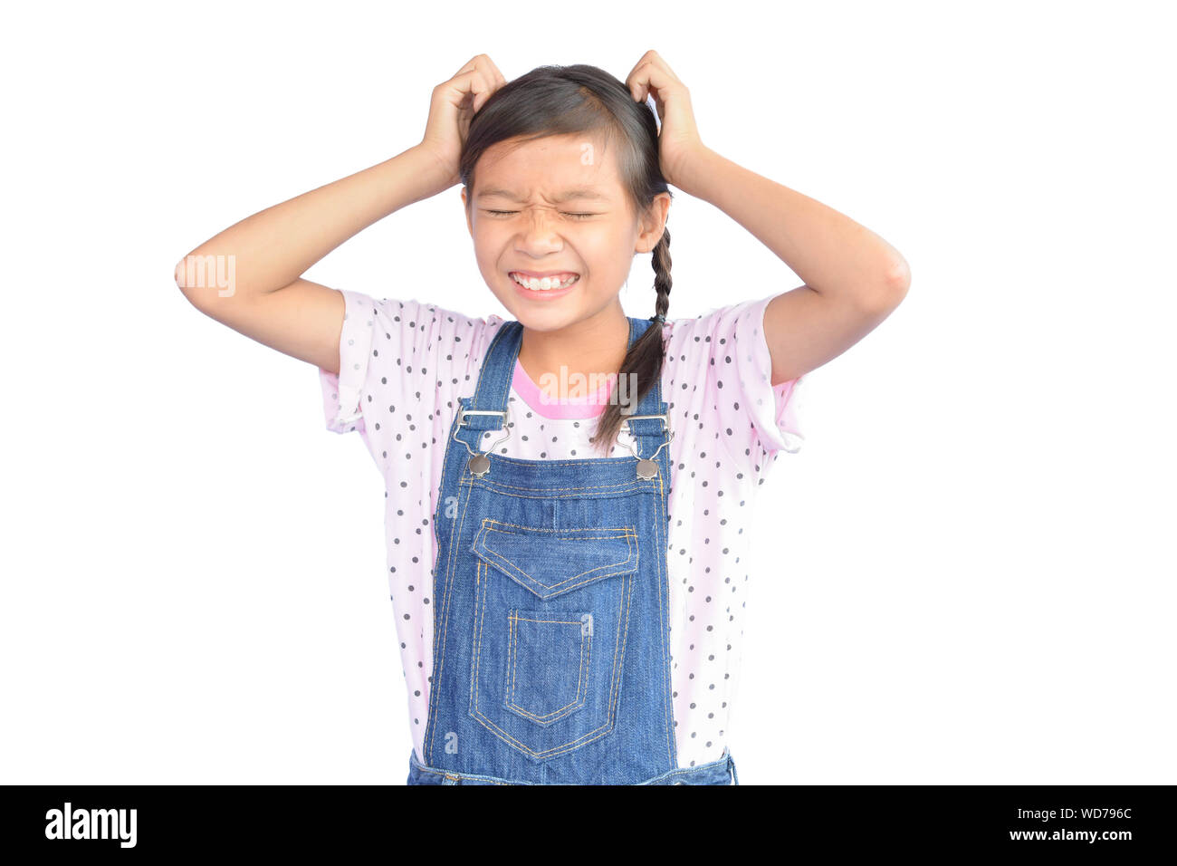 Frustrated Girl Standing Against White Background Stock Photo